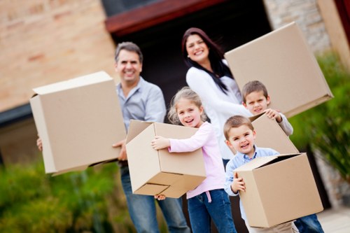 Family loading boxes into a mobile self storage container
