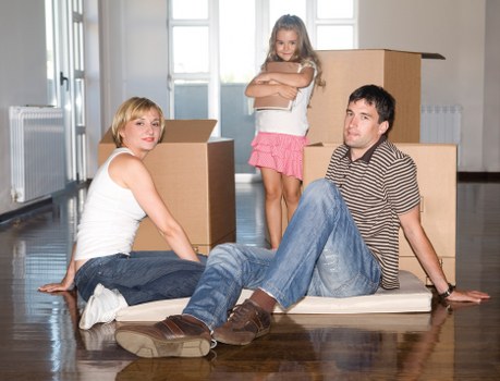 Local movers handling boxes during a small removal job in Oakleighpark